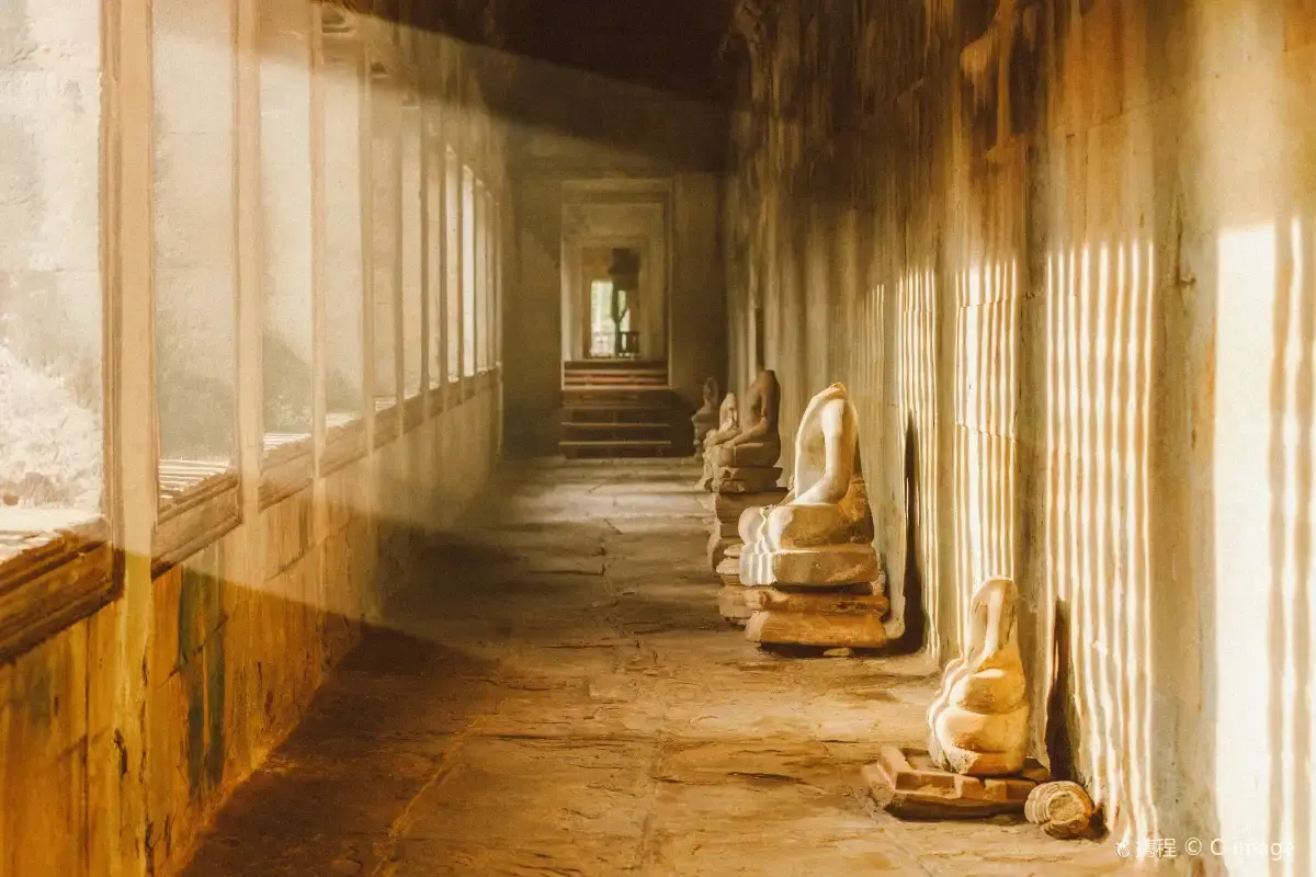 Bas-relief carvings running along the gallery walls of Angkor Wat